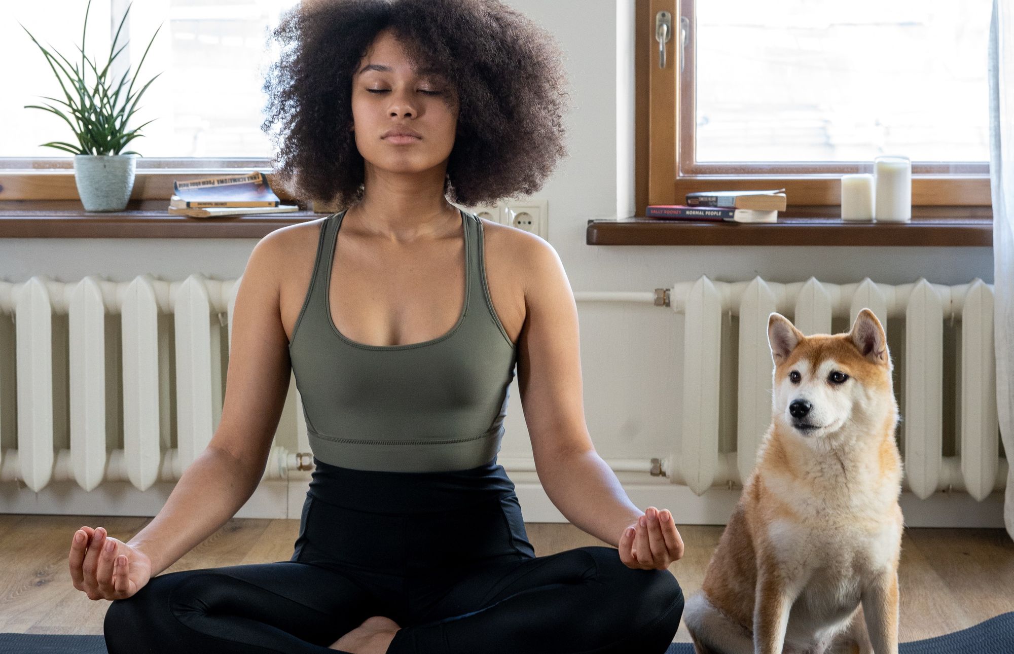 Lady with dog meditating for focus 