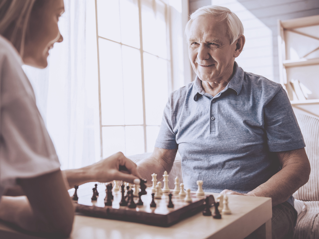 Old person playing chess to prevent Alzheimer's disease