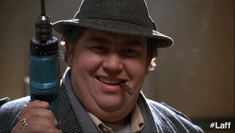 Drill practice John Candy holding a drill funny