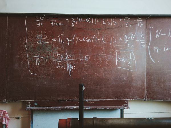 Physics concepts on a blackboard